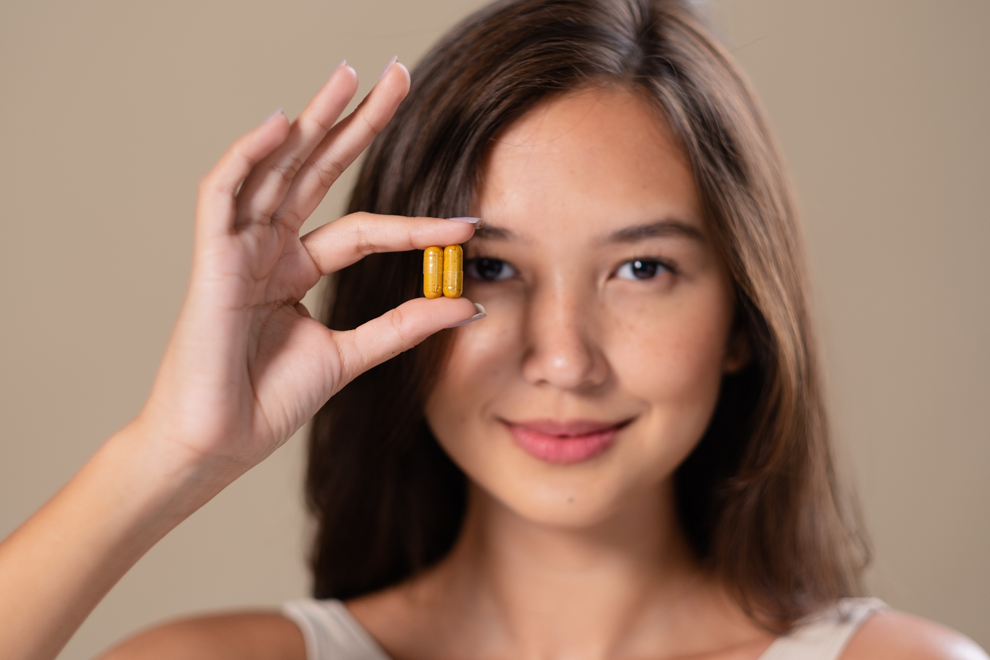 Portrait of Woman with Capsule Supplement